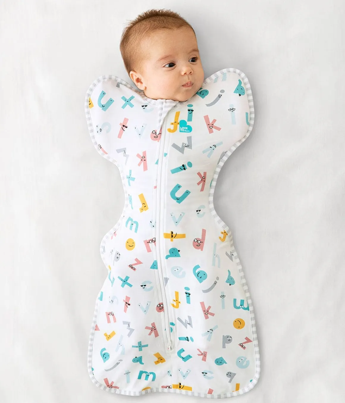 Love To Dream Swaddle UP Ecovero Moderate, Small - Alphabet Soup White
